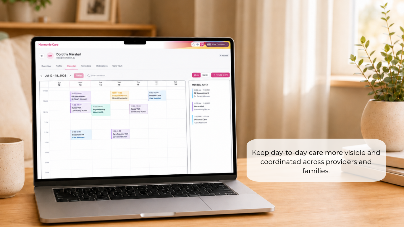 A laptop on a wooden table displaying a digital calendar interface, with a soft-focus home interior in the background and a text callout that reads, 'Keep day-to-day care more visible and coordinated across providers and families.'.